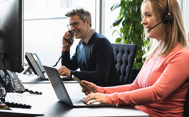 Customer support staff on call and working
